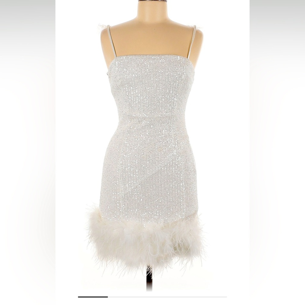 Sz Jr M stretchy white sequin dress with feather trim and adjustable straps.